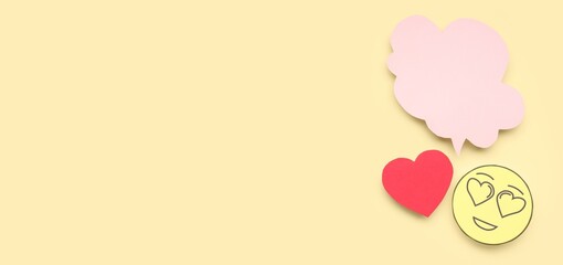 Paper emoticon, heart and blank speech bubble on beige background with space for text. Dialogue concept