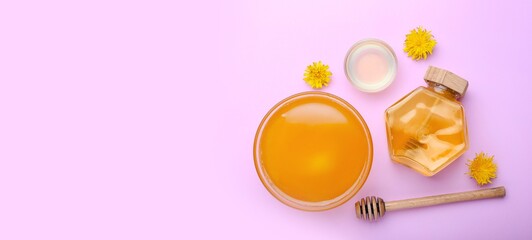 Sweet dandelion honey on lilac background with space for text, top view