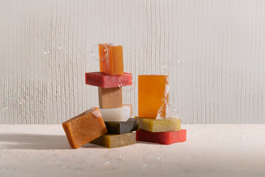 Stacked soaps with bubbles. Clean and minimalistic composition.