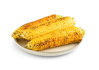 Plate with tasty grilled corn cobs on white background