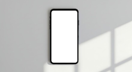 A person's hand holding a modern smartphone with a blank white screen, perfect for a digital mockup or template on a clean, bright background.