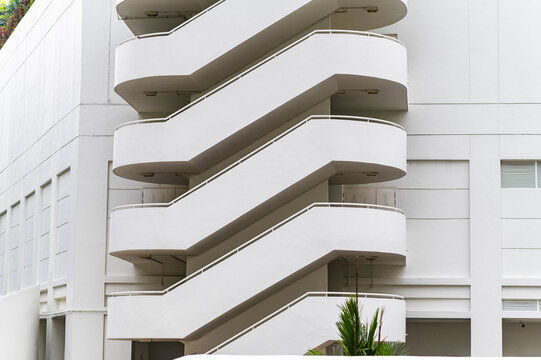 Zigzag staircase on white modern wall