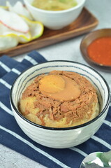 Steamed rice with chicken and egg, served with cracker and chilli,  comfort food for breakfast