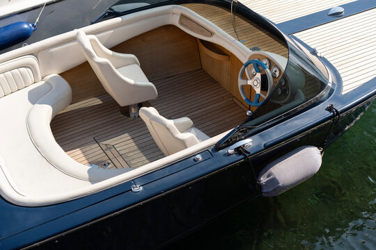 Luxury Boat Interior with Modern Seats and Steering Wheel
