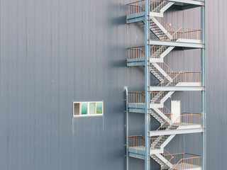 Modern Warehouse Exterior with Fire Escape Stairs