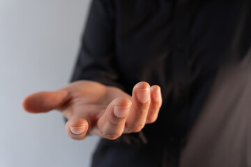 Person's hand with the palm facing up, showing or offering something