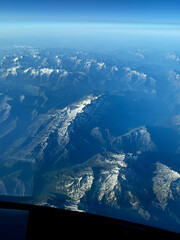 An aerial view over the French Italian Alps during a summer afternoon.