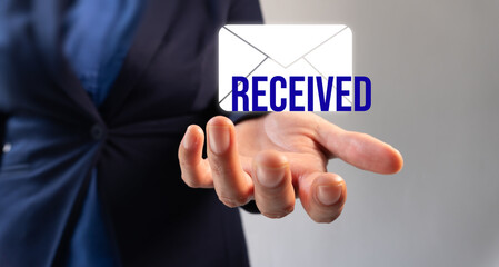 Female executive holding an email icon with the word 