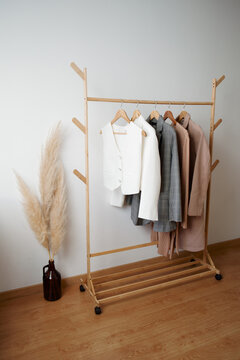 Clothes Rack Displaying Stylish Outfits in a Modern Interior