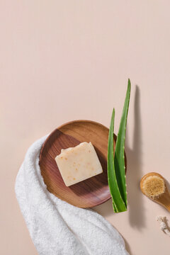 Natural skincare scene with soap, aloe vera, and spa essentials