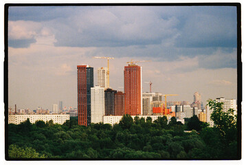 Modern skyscrapers rise against a cloudy skyline