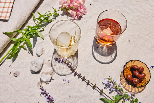 Messy table with ice and drinks after a summer party outside