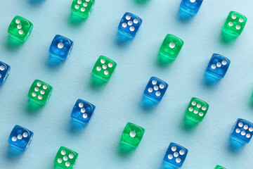 Different game dices on blue background