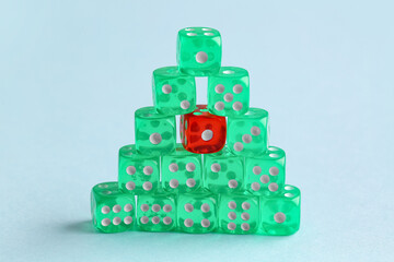 Stack of game dices on blue background