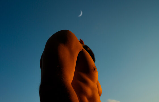 Sensual Meditative Person and Crescent Moon At Sunset