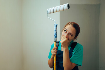 Woman Dislikes the Smell in a Recently Painted Room. Unhappily worker complaining about paint fumes...