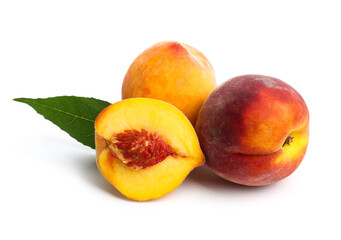 Sweet ripe peaches and leaf on white background