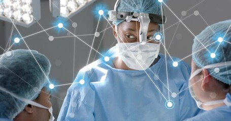 Female surgeon glancing at assistants, initiating blue nodes forming health network guiding surgery - Powered by Adobe