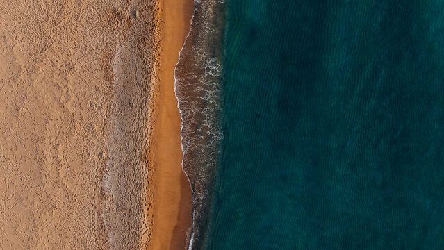  Drone Shot of Footprints and Waves on Sardinian Beach