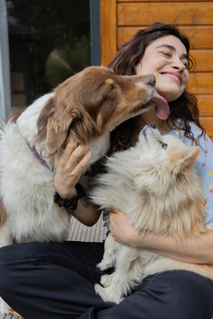 dog licking woman's face