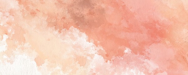 Fototapeta premium Muted peach watercolor paint creates a soft, ethereal texture across the background