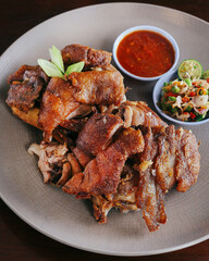 Crispy Fried Pork Knuckle with Chili Sauce and Fresh Vegetable Relish – Indonesian Cuisine