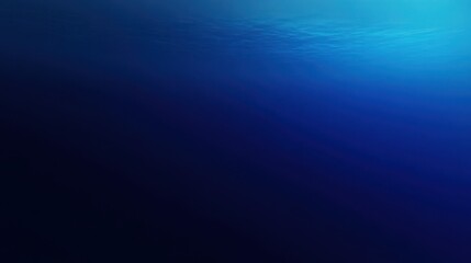 Obraz premium Serene Underwater of Deep Blue Ocean with Glistening Sunlit Surface