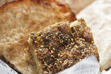 Savory herb bread with sesame seeds served in restaurant