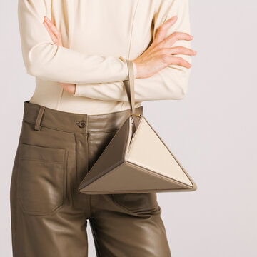 Modern Triangular Bag Paired with Stylish Leather Outfit