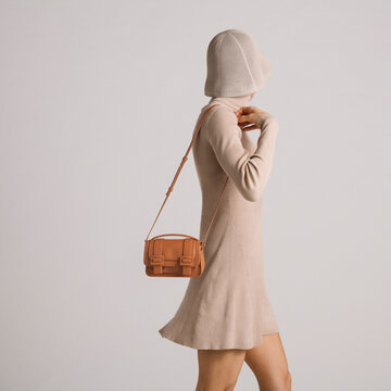 Elegant Outfit Featuring Beige Dress and Stylish Crossbody Bag