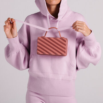 Modern Fashion with a Compact Stripe-Patterned Handbag and Paste