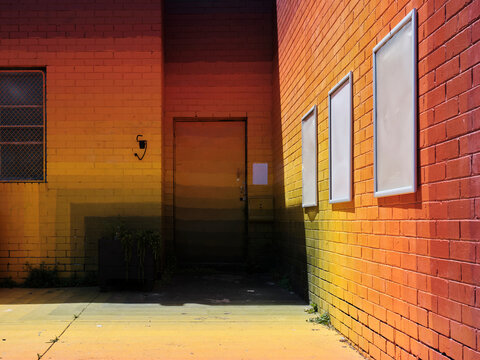 Colorful Urban Wall With Door and Empty Frames at Sunset