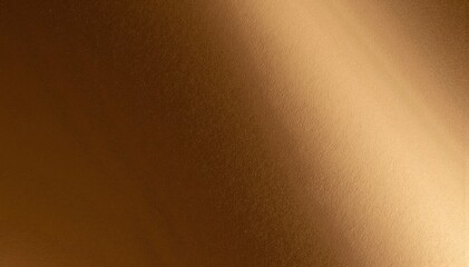 Fototapeta premium A vibrant close-up of an orange wall, showcasing its textured surface with subtle variations in hue, casting warm, inviting shadows.
