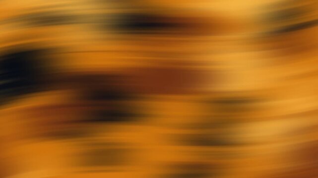 Blurred abstract pattern in brown and orange hues, suitable for backgrounds, digital design projects, halloween, and artistic concepts with warm tones.