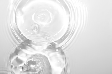 Clear Water Ripples Creating Circular Patterns in Calm Surface