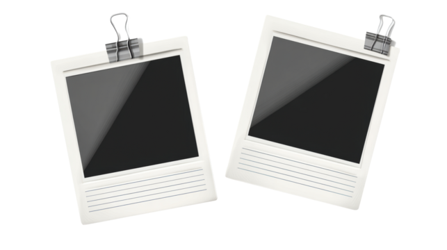 Two instant photo prints with binder clips attached