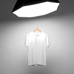 White t-shirt hanging under large studio light