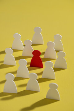 Conceptual image of a leader standing out from the team