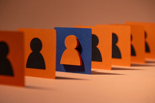 A distinct paper cutout highlights leadership and team unity