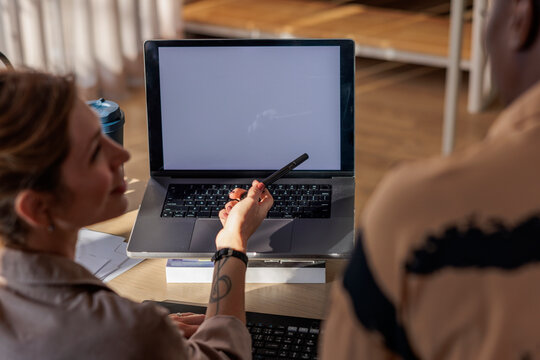Real estate agent goes through her presentation on her laptop