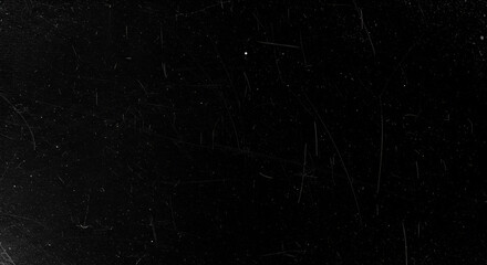 Black scratched surface texture creates a vintage and distressed background