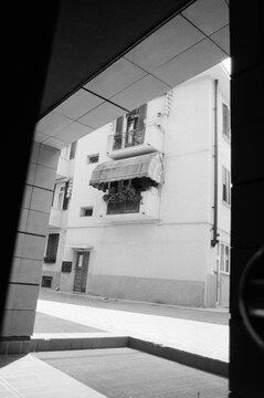 Fototapeta Black and white film photo of Italian house with balcony