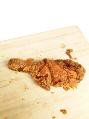Fried Chicken Leg on a Light Wood Background