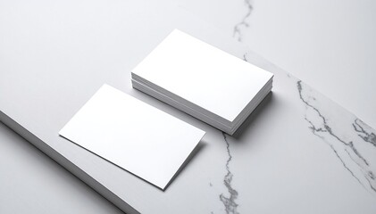 Two elegant business cards resting on a polished marble surface, showcasing vibrant designs and crisp text, reflecting professionalism and style.