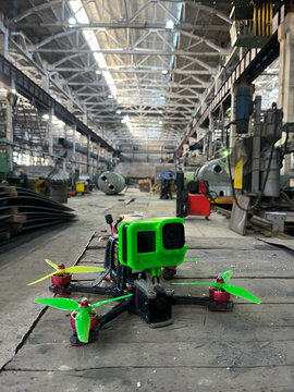 FPV drone on table in industrial workshop