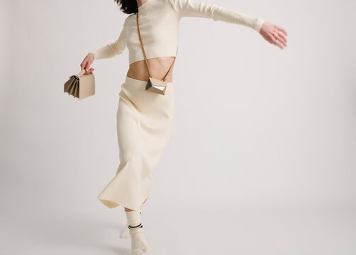 Minimalist Fashion Moment With Stylish Beige Outfit and Geometri