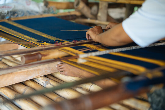 Traditional Hand Weaving on a Bamboo Loom in Indonesia