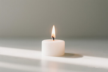burning candle on a white background