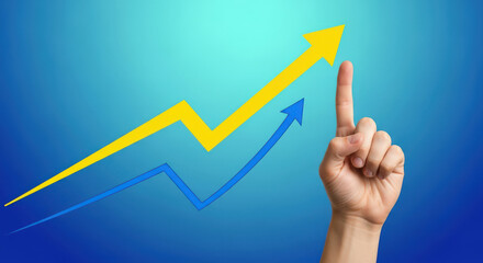 Upward Trend and Business Growth Concept Hand Pointing to Rising Arrows on a Blue Background Symbolizing Progress, Achievement, and Positive Financial Performance
