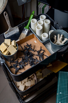Top view of diy tools, materials, blanks and stencils in an workshop